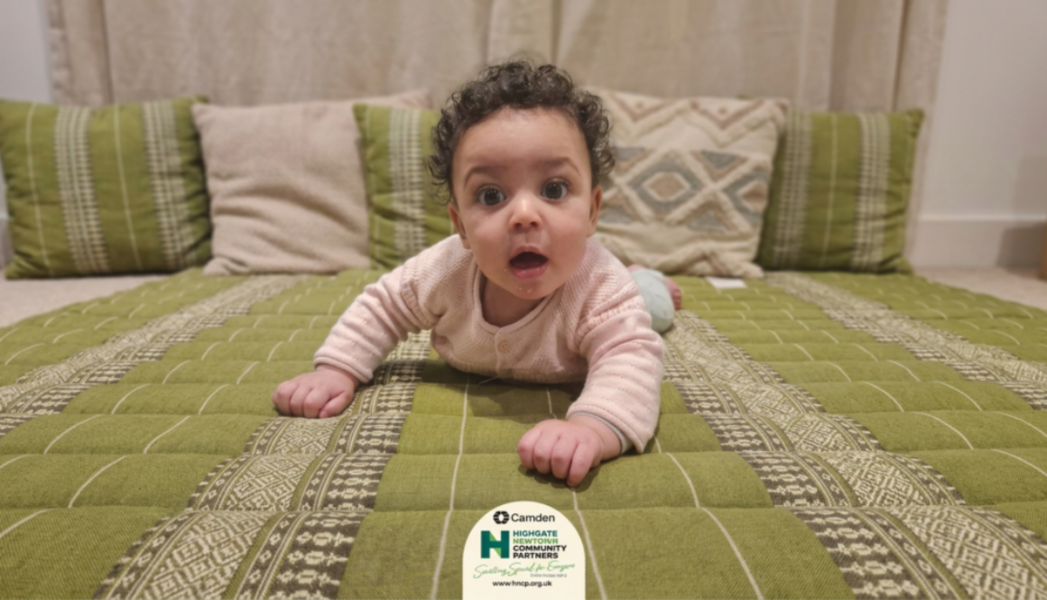 Baby looking at camera - logo